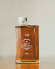 Un pot de sirop d'érable pur doré de l'entreprise Trace - Érable & Territoire.