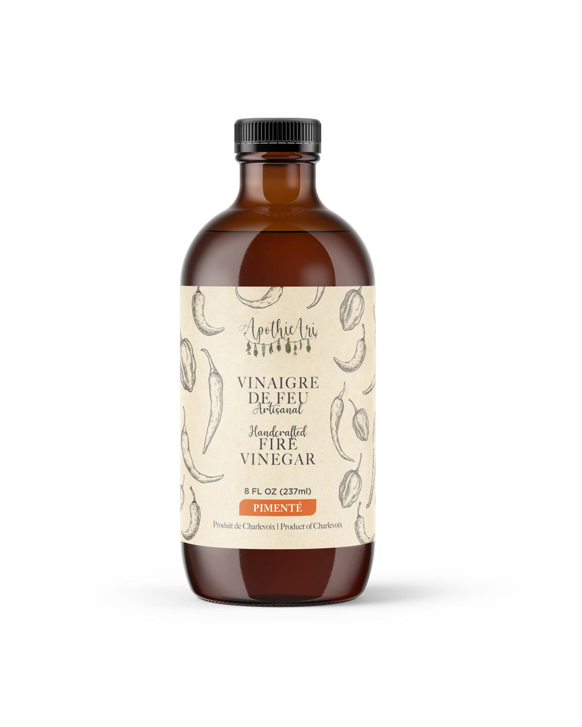 Un pot de vinaigre de feu pimenté sur fond blanc.